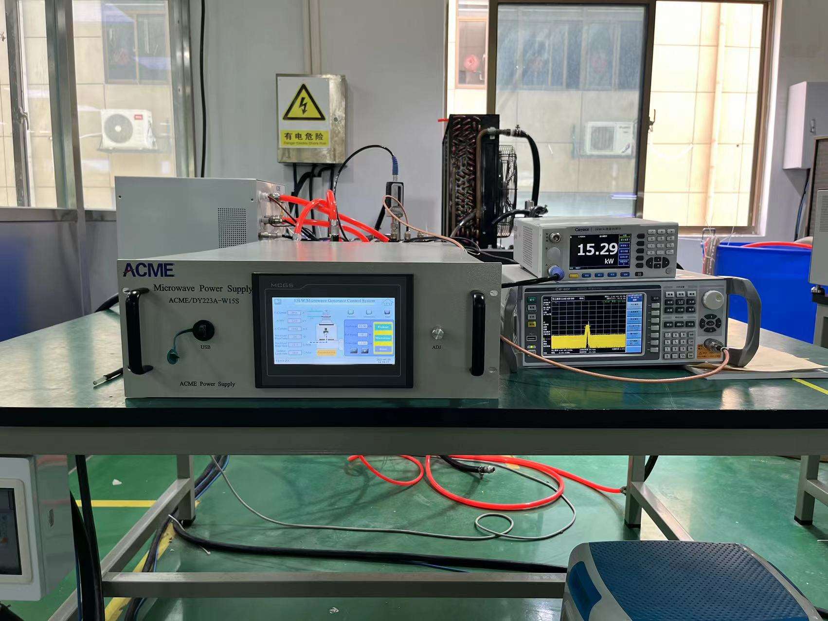 15 kW microwave generator connected to HMI and measurement instruments during functional testing