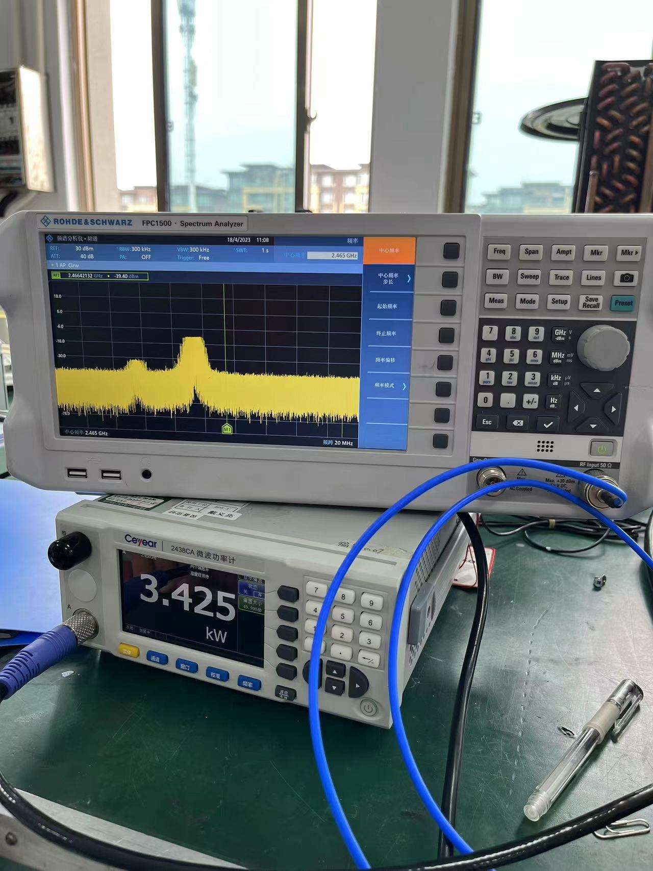Spectrum and power measurement instruments used during a 6 kW microwave generator test