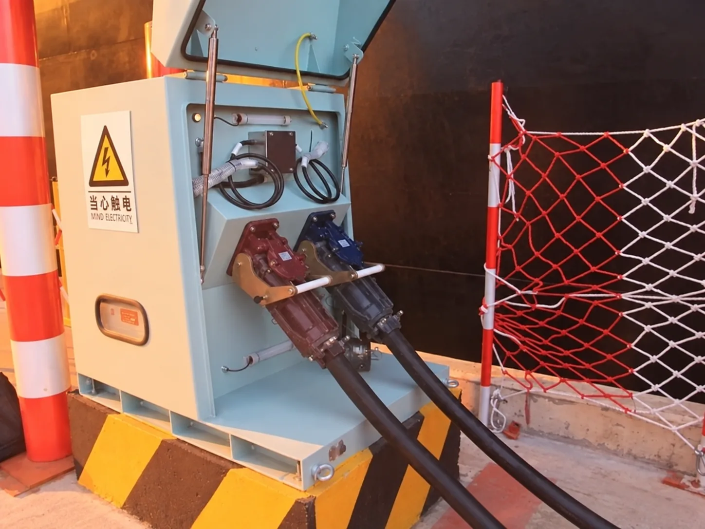 Shore power cable connected at the berth showing cable approach and connection geometry